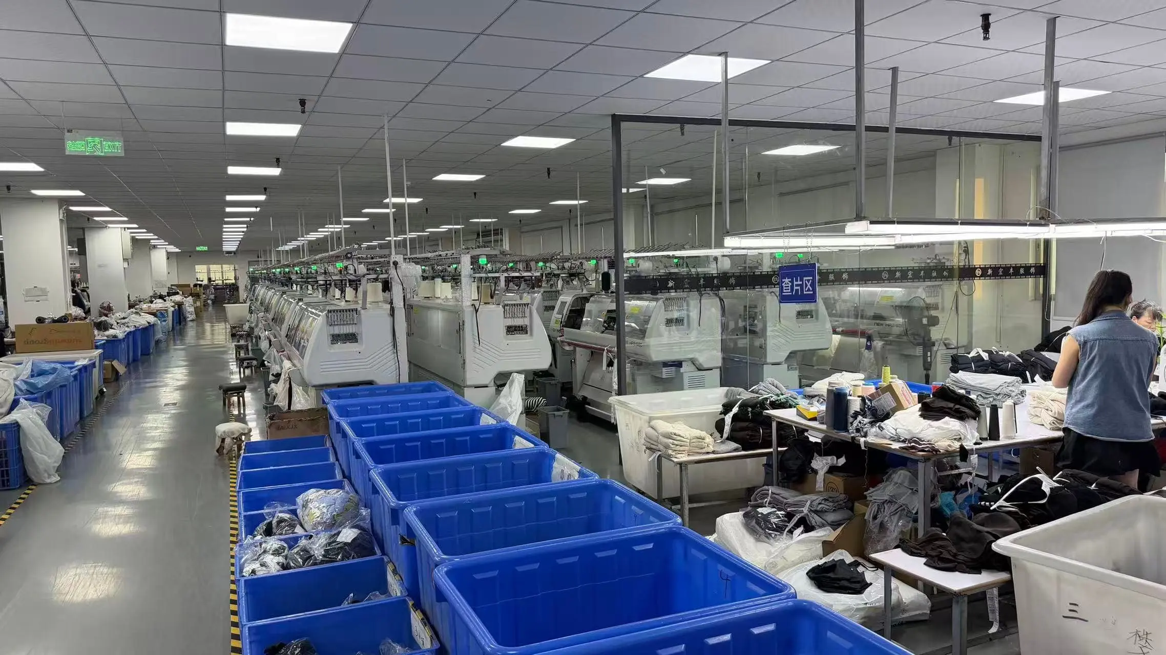 EtrenerKnit professional QC laboratory with inspector examining knitwear quality using precision measurement tools and gauges